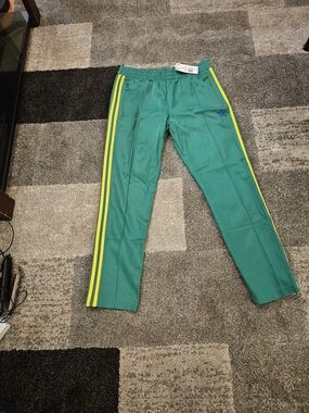 Adidas Green Track Pants with Yellow Stripes